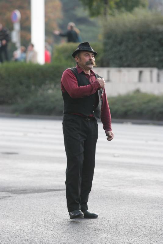 The protester adjusting his vest